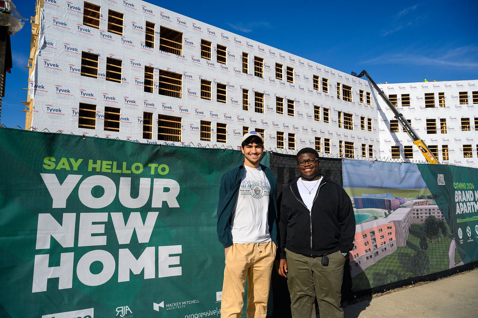 Auryon Azar and Cedrick Charles in front of the future New Lakeview Apartments at EMU.