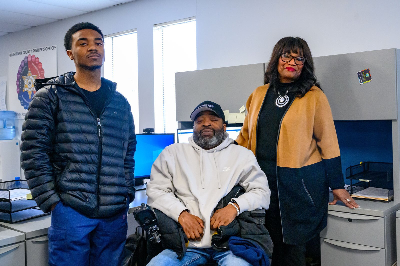 WeLIVE's Trevonte Thomas and Roger Roper with SURE Moms' Florence Roberson.
