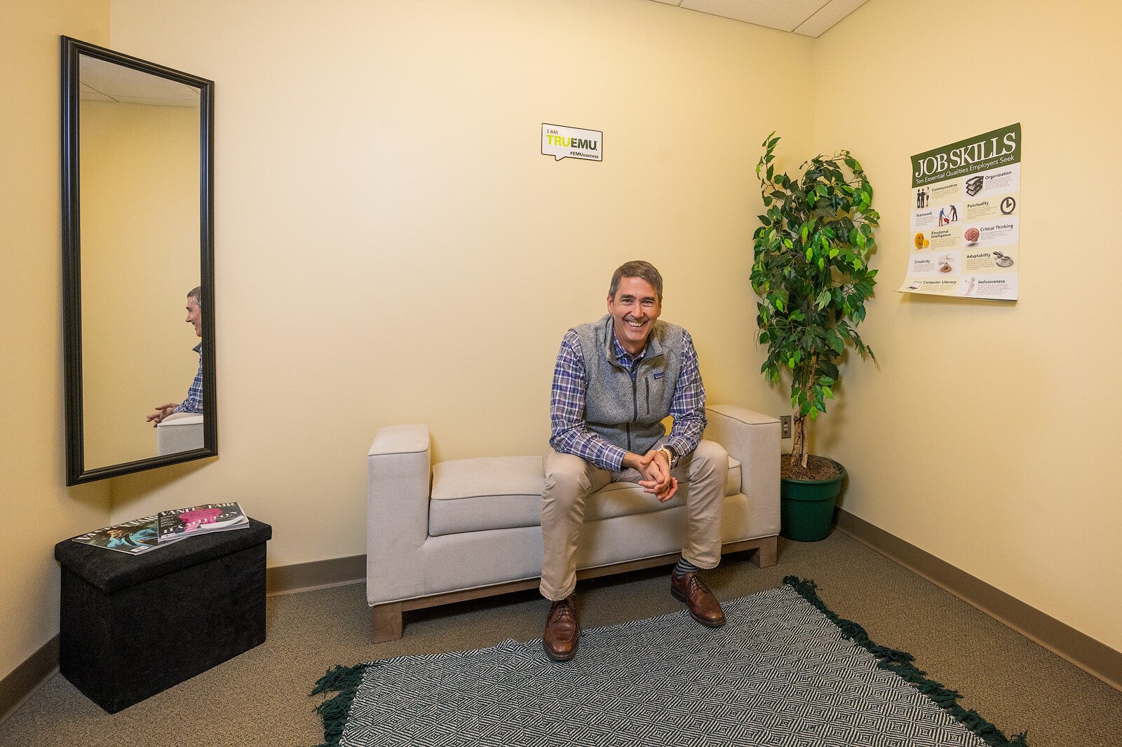 John Carlson in the dressing room of the EMU Career Closet.