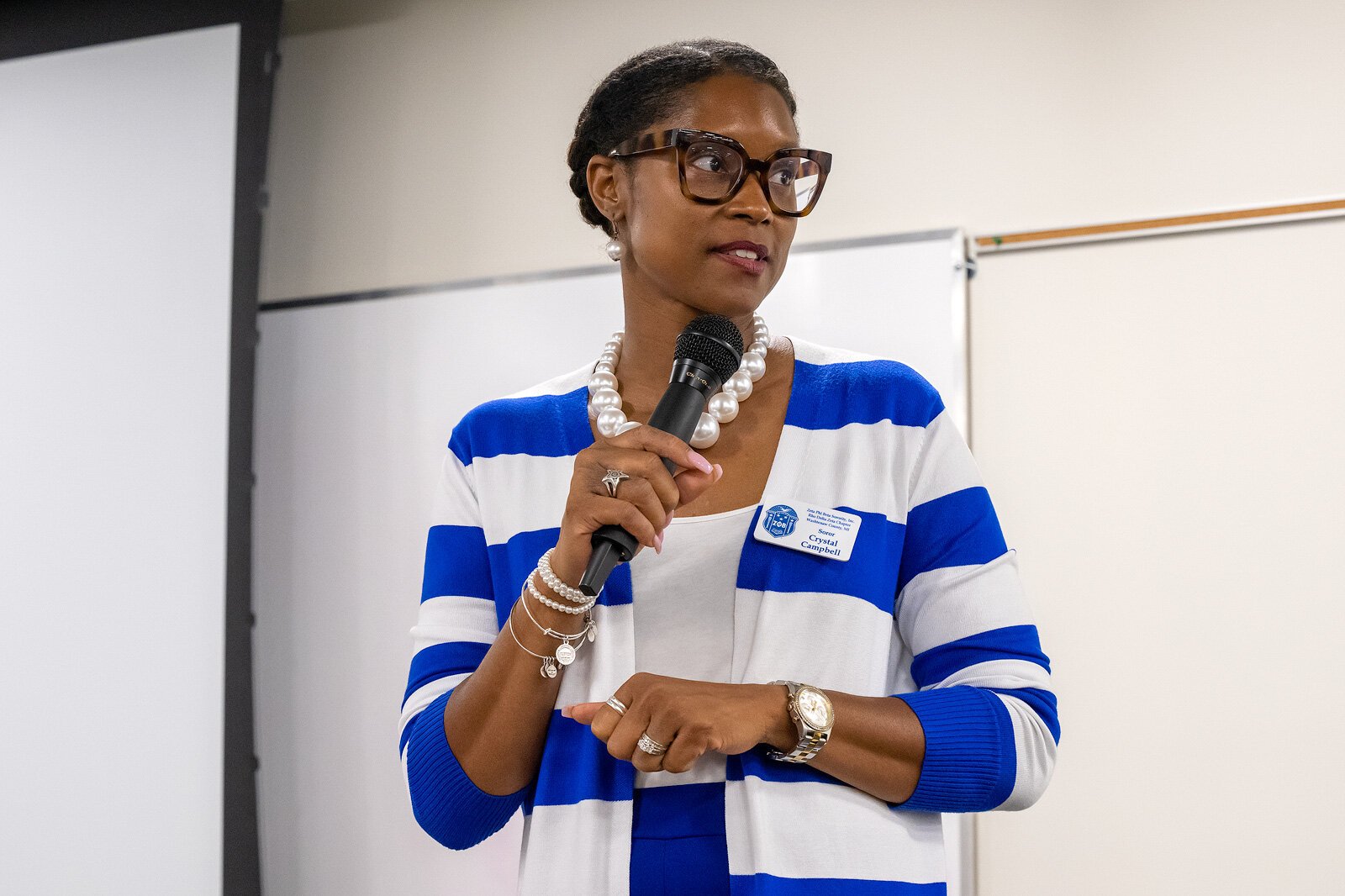 Crystal Campbell moderating the Divine Nine's Washtenaw County School Board Candidates' Forum.