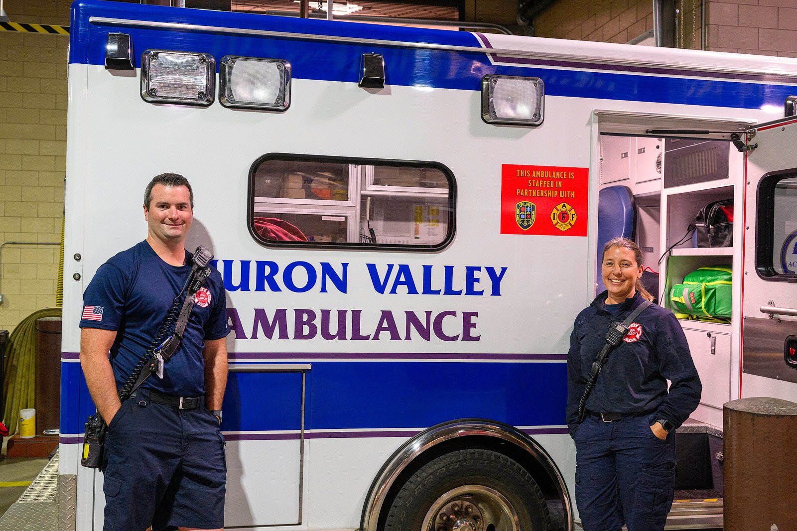 Chris Roy and Danielle LaLonde with an HVA ambulance at Ann Arbor Fire Department Station 1.