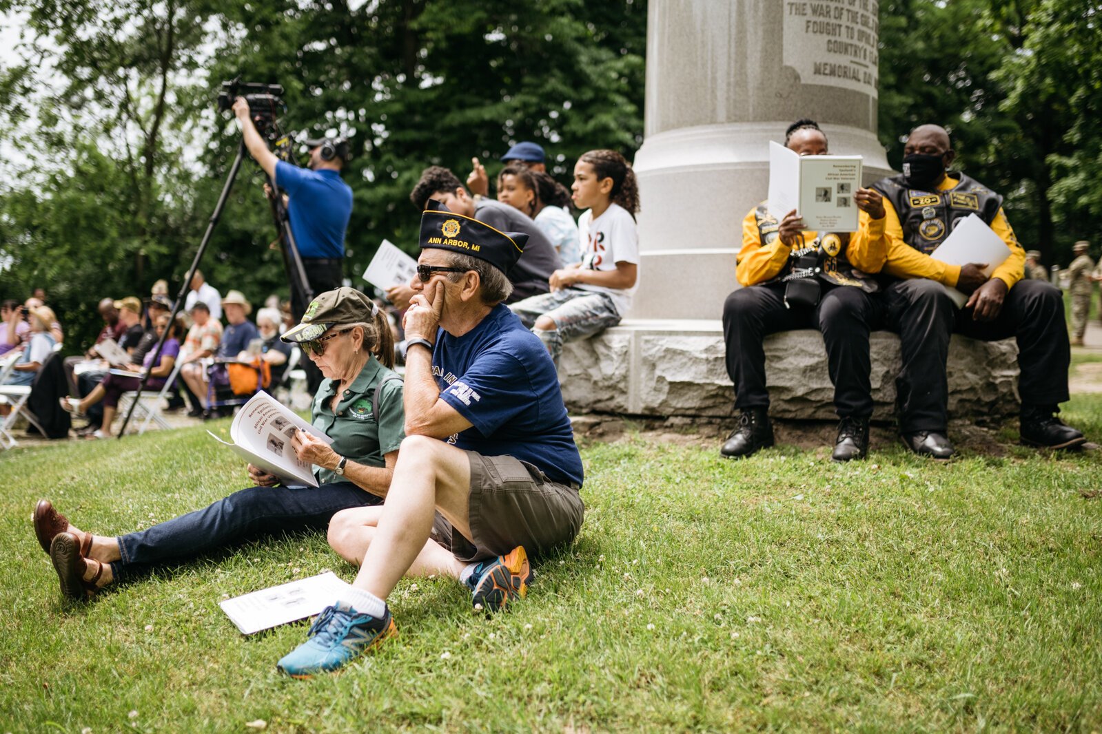 Attendees watch the unveiling ceremony for the monument.