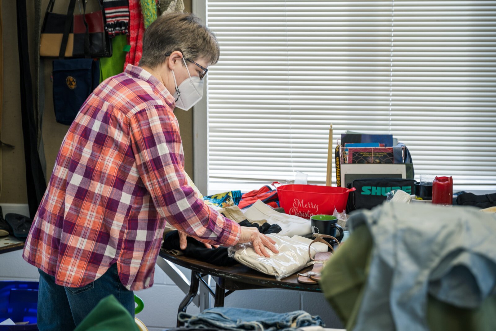 Bunny Arbaugh processes donations at Auntie Yvonne's Community Free Store.