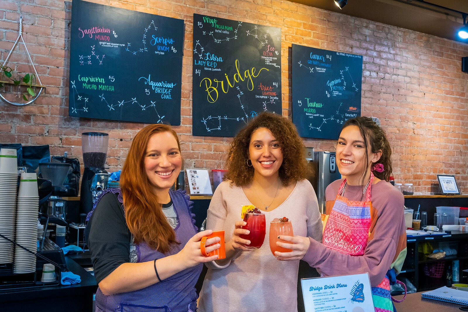 Maria Pomo Castillo, Gabrielle Watts, and Sierra Lambert with mocktails at Brdige Community Cafe.