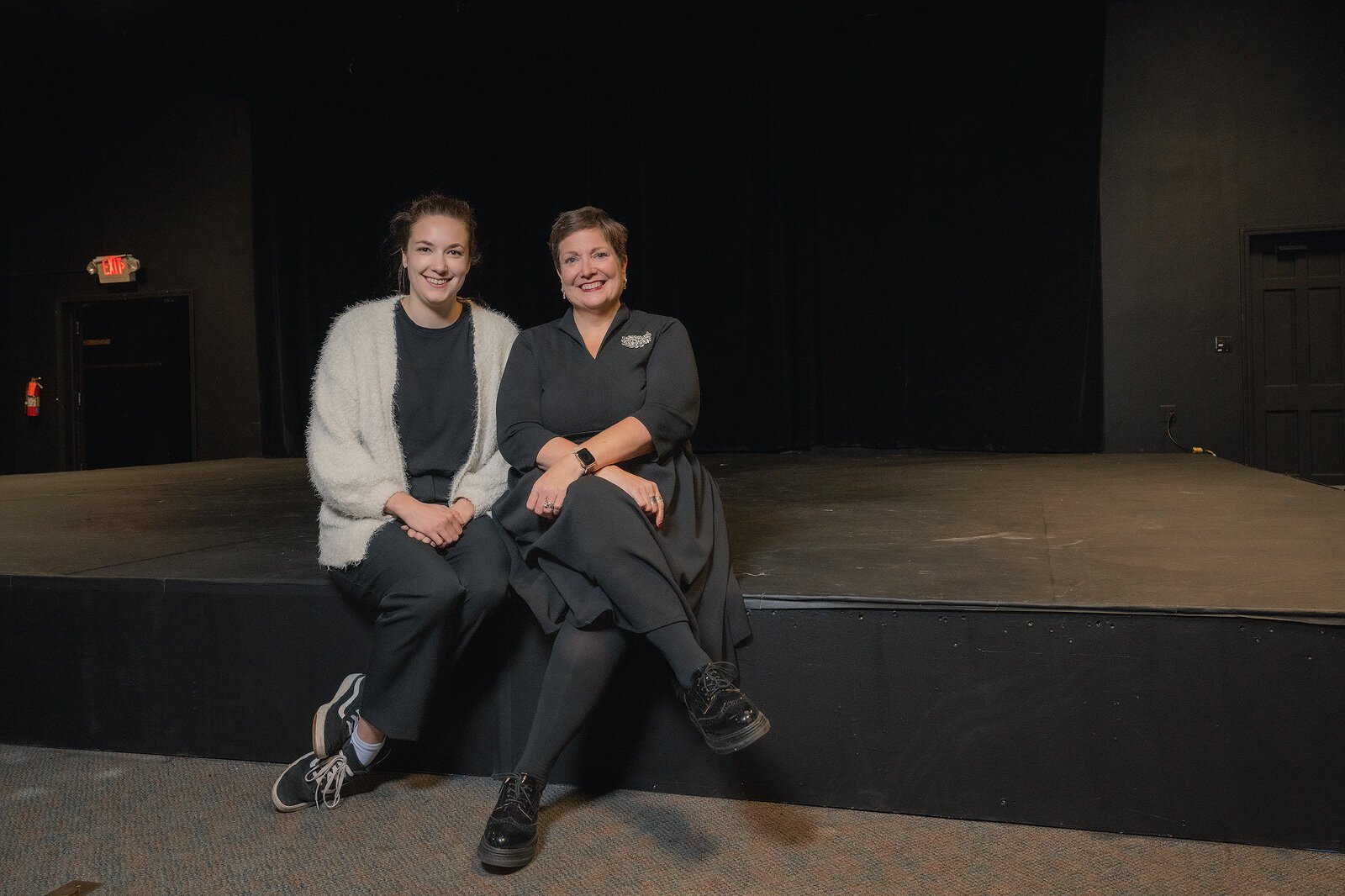 RAC Manager of Operations Maggie Spencer and Executive Director Amy Fracker in the theater at RAC.