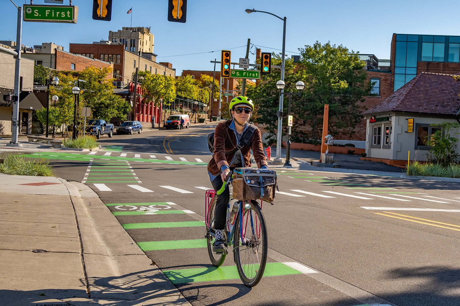 Jade Marks riding her bike on the West Liberty Street bike lane in Ann Arbor.