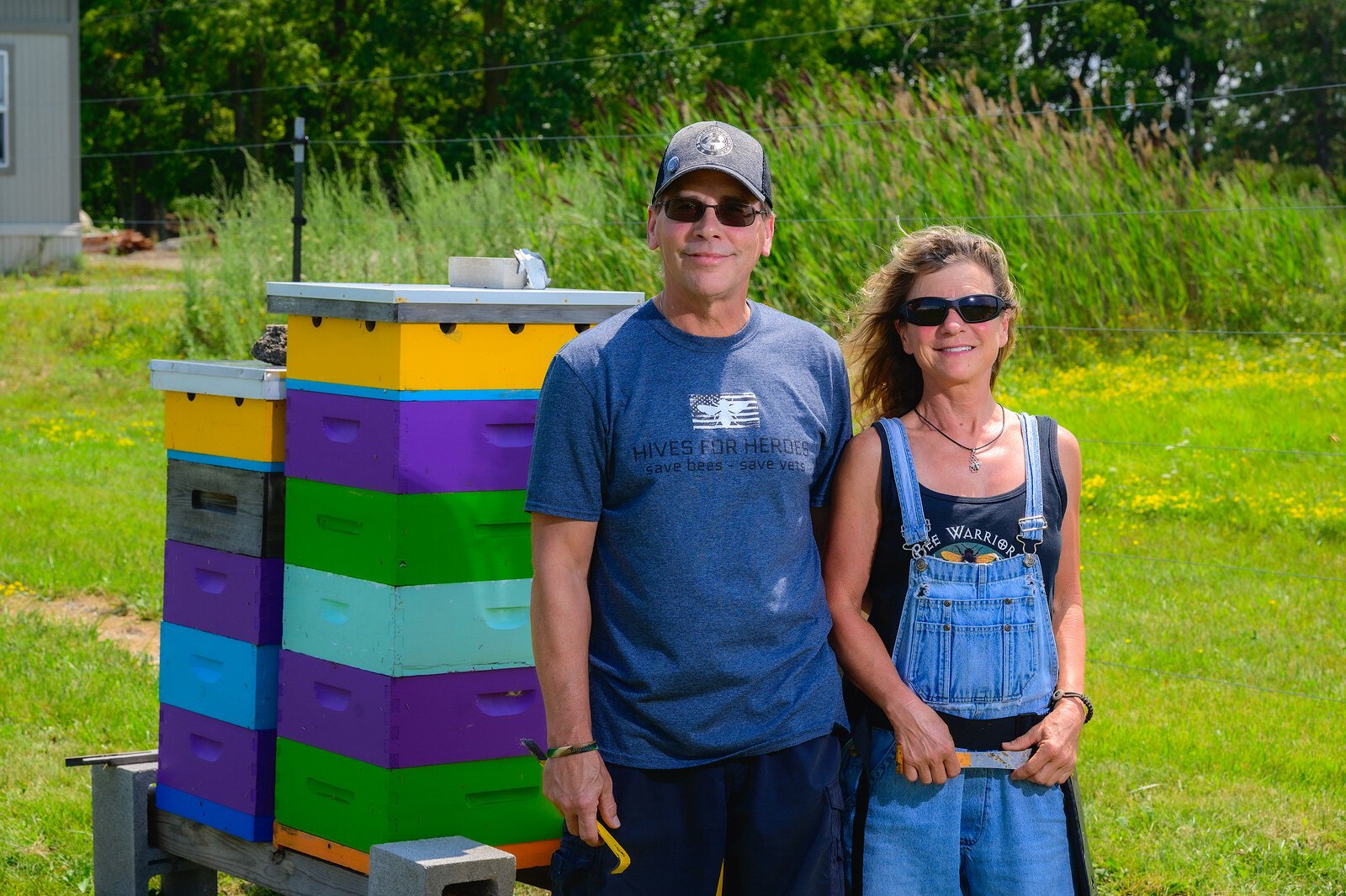 Eric Spalding and Cecilia Infante with bee hives at The Farm at St. Joe.