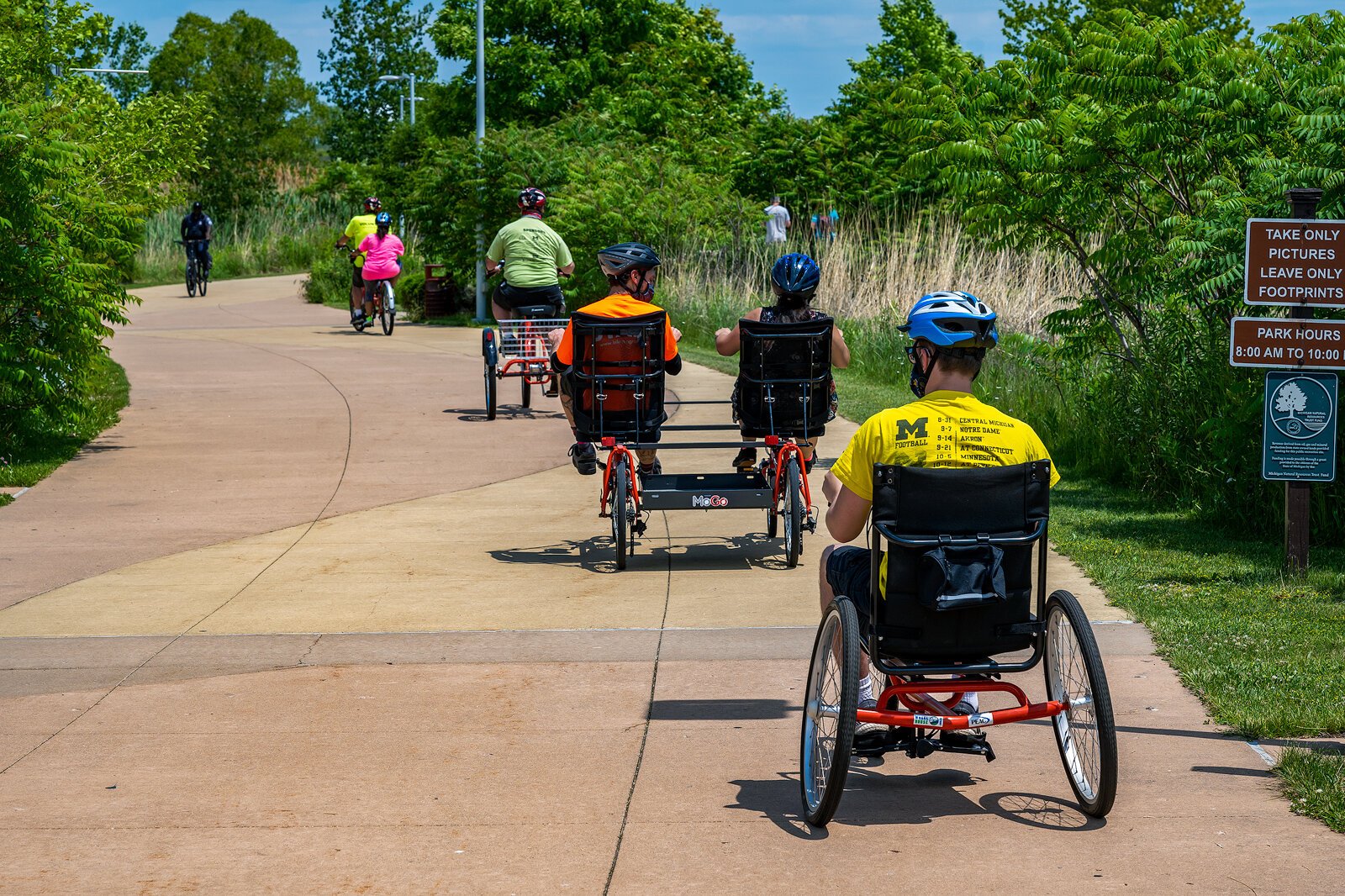 PEAC students ride MoGo adaptive cycles on the Detroit Riverwalk.