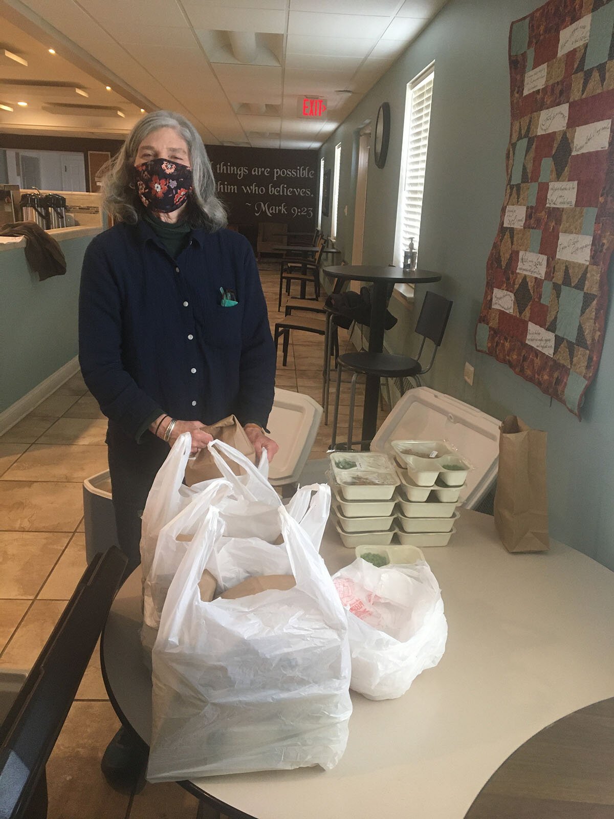 An Ypsilanti Meals on Wheels staffer with meals to be delivered.