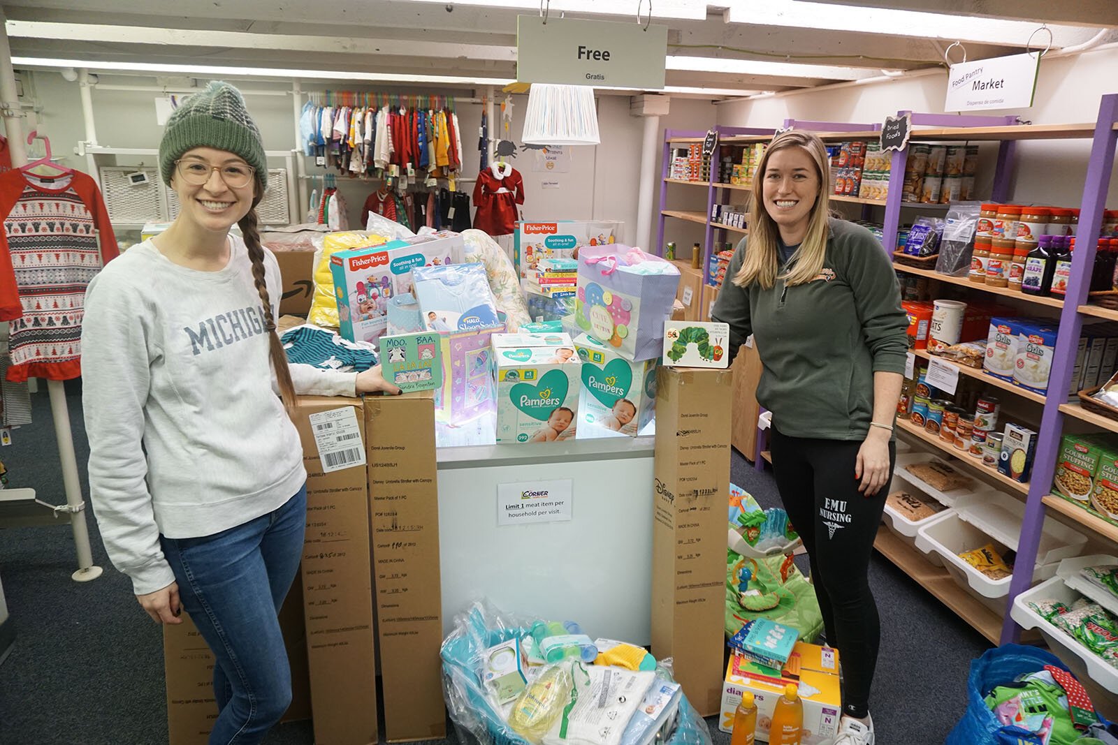 Corner Health Center staff with baby supplies for patients.