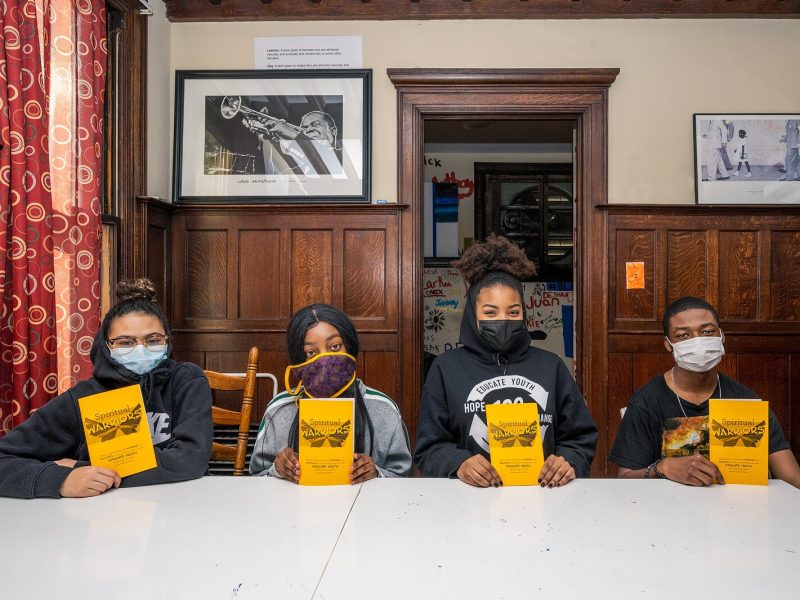 L to R Educate Youth students Morgan Hargrove, Breanna Mayers, Lehana Mayers, and Reese Weatherspoon with copies of the "Spiritual Warriors" poetry book.