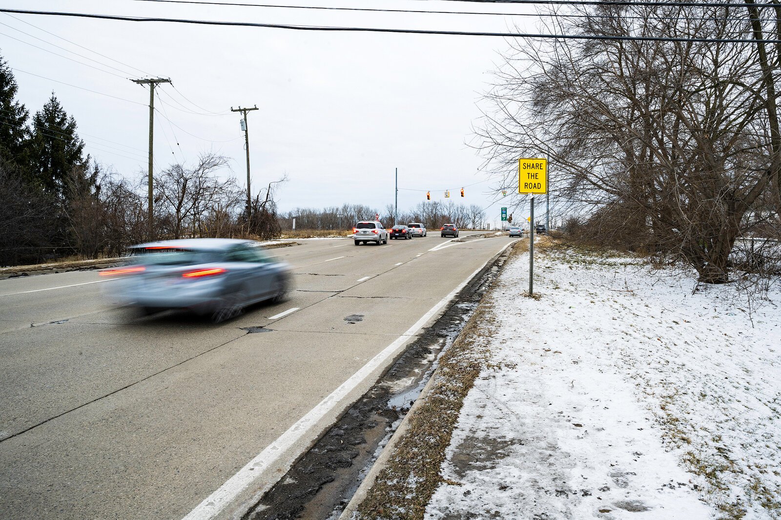 The end of the sidewalk on Huron Street before the westbound I-94 onramp.