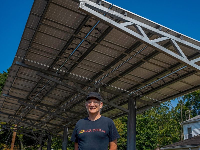 Dave Strenski in front of a solar installation at the Thompson Block in Ypsilanti.