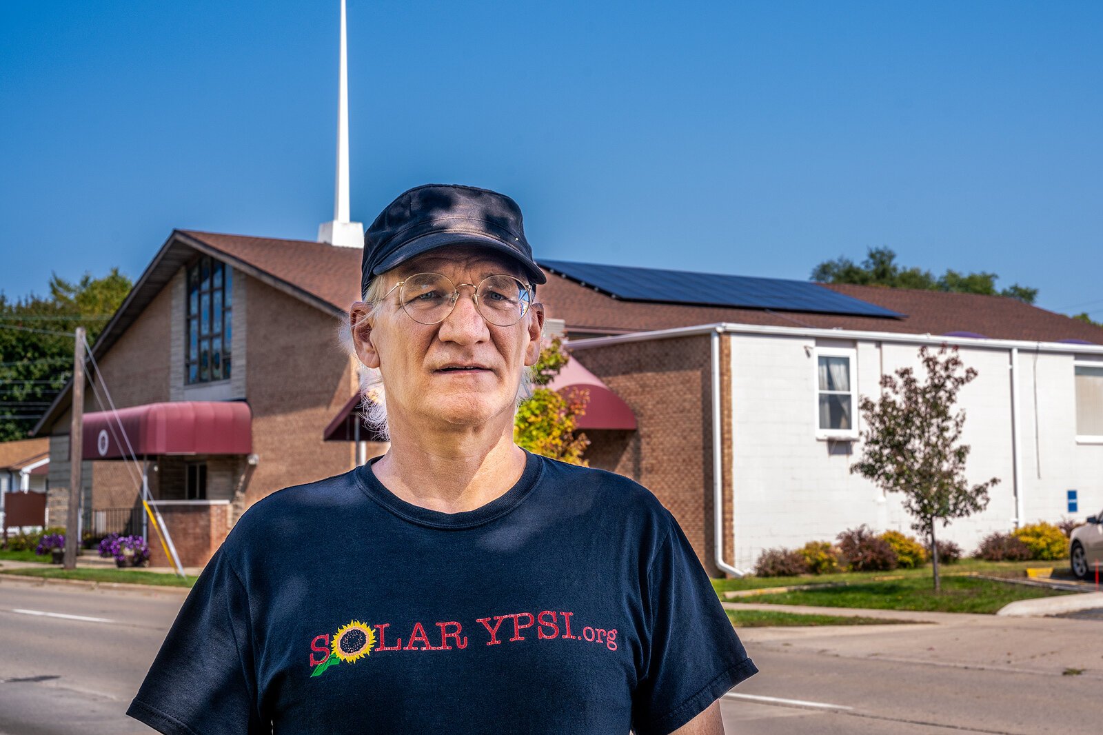 Dave Strenski in front of a solar installation at Second Baptist Church in Ypsilanti.