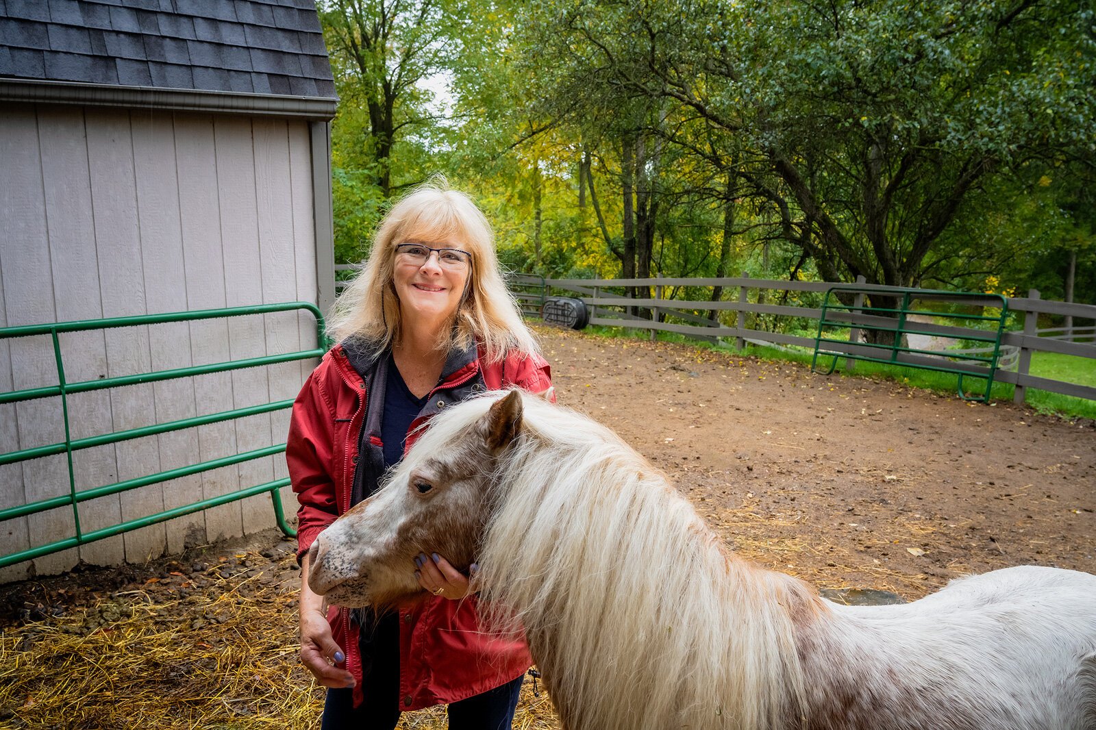 Alison Paine, pictured with her horse Johnny, sometimes leads equine therapy programming.