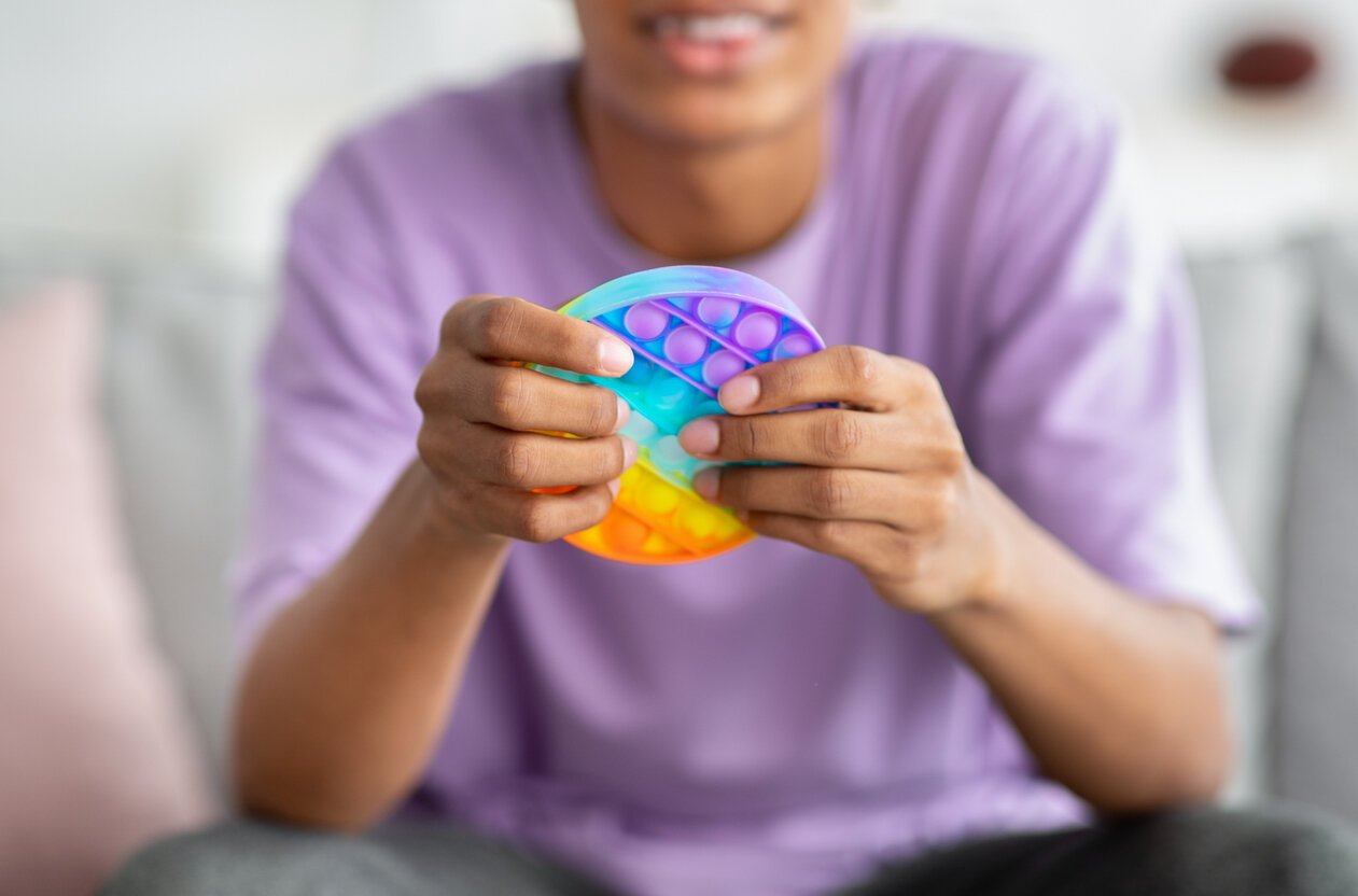 Playing with fidget toys can help a child function effectively or engage with others. 