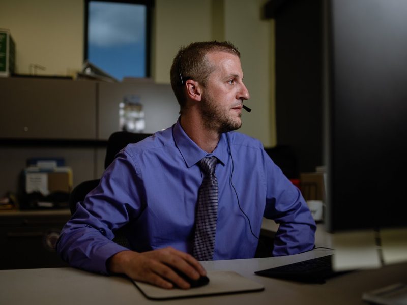 Brian Nicholson, MiCAL program director for Oakland County-based crisis services agency Common Ground, takes a call for the Michigan Crisis and Access Line (MiCAL).