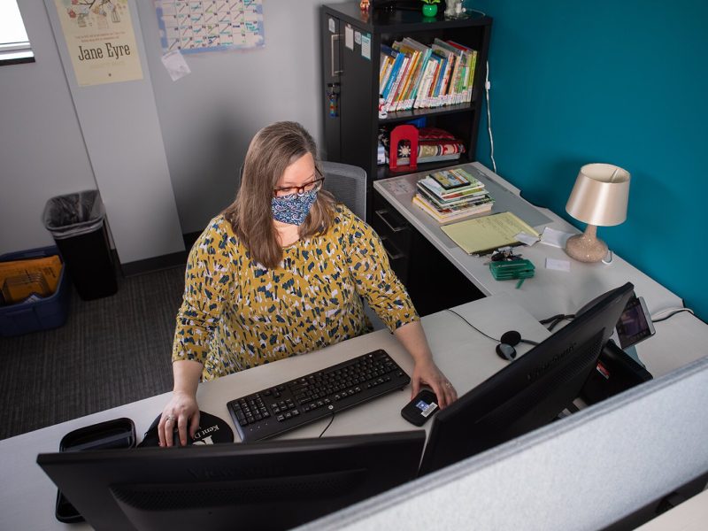 Joyanne Huston-Swanson, community relations for the Kent District Library, works with a wi-fi hotspot that is available for checkout at the library. Patrons have used the hotspots to access telehealth appointments, among other needs.