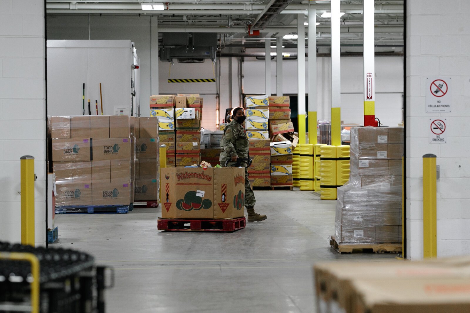 An Air Force Reserve member works in the Food Bank of Eastern Michigan warehouse.