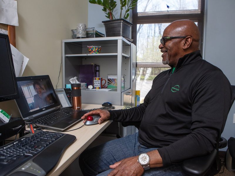 Arbor Circle therapist Marvin Mckenzie simulates a telehealth visit with a colleague.