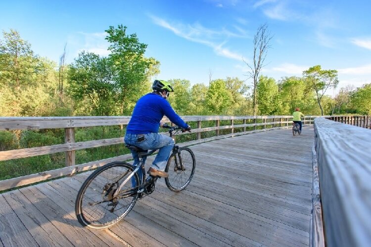 A biker pedals along down the B2B Trail.