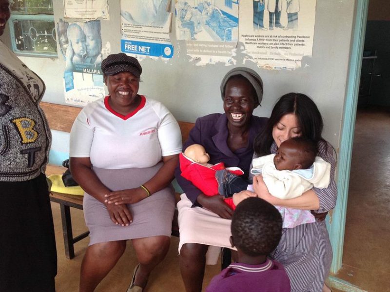 Warmilu staff demonstrates their warming blankets in Kenya.