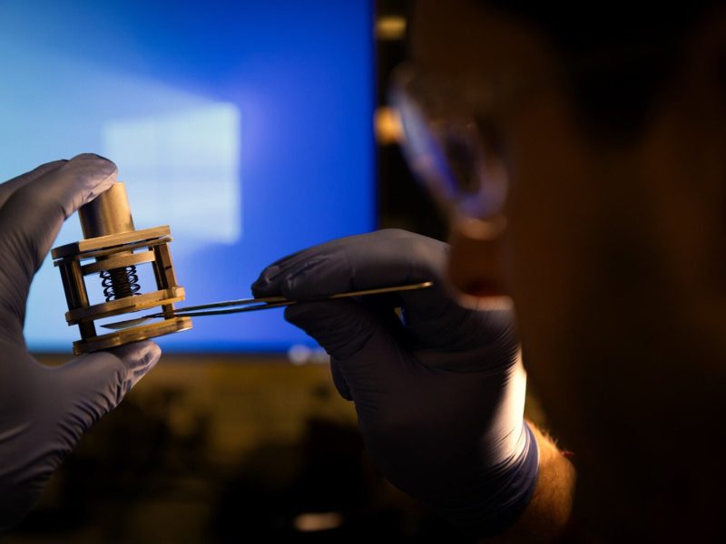 U-M assistant professor Jovan Kamcev places a filter membrane between two electrodes, which measure how well the membrane conducts electricity. This helps his team predict how well it can purify water.