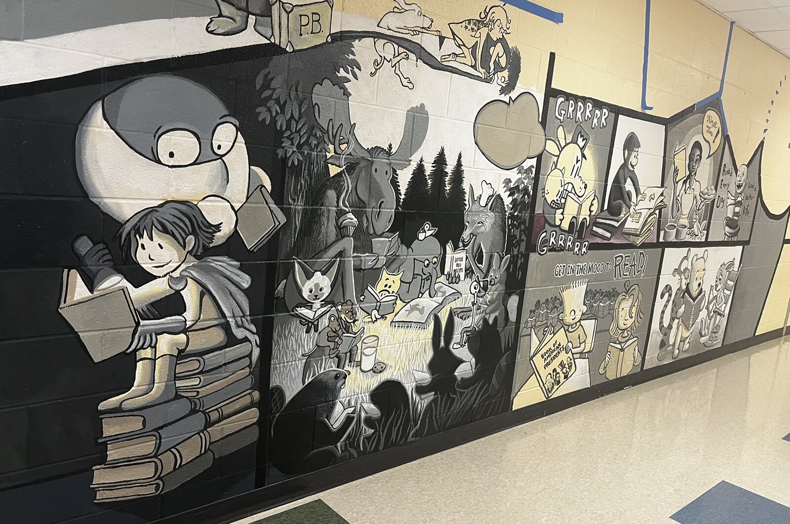 Stacy Schwartz's mural, "Reading Can Take You Places," at Estabrook Elementary School.