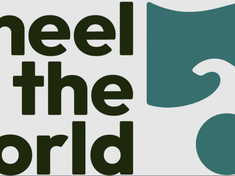 Wheel the World's logo. The travel website for travelers with disabilities recently recognized the Ann Arbor area for its accessibility.