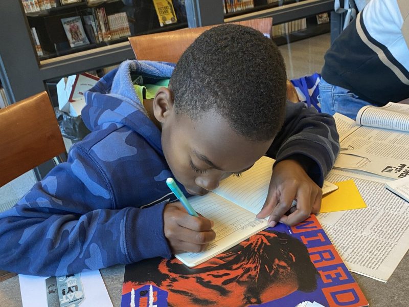 A young person writes at a Dzanc House workshop.