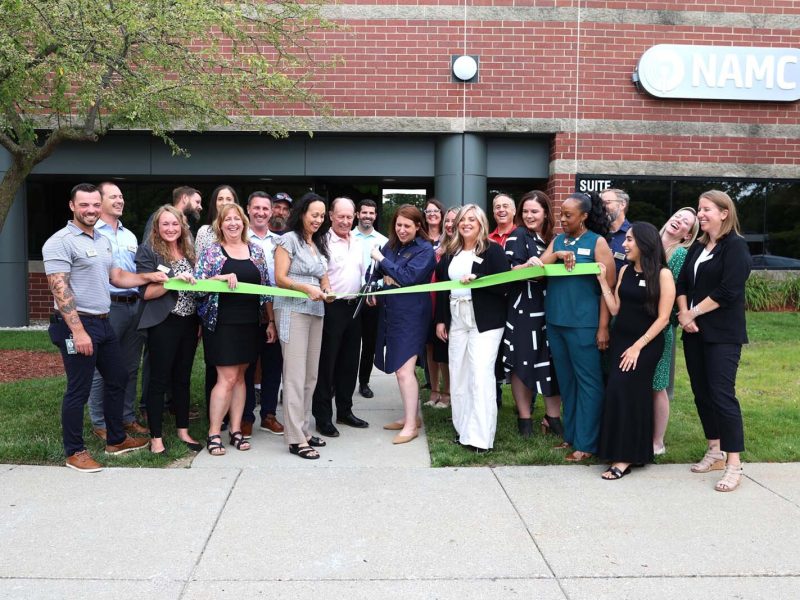 A ribbon cutting for NAMC's new headquarters in Ann Arbor.