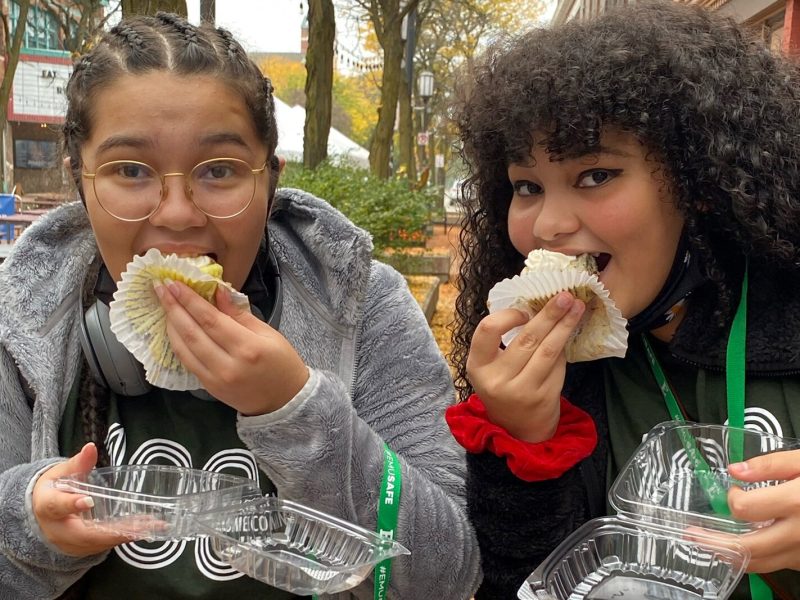 Participants eat cake at last year's YpsiTasty grub crawl.