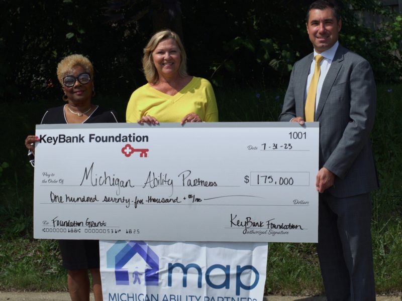 Michigan Ability Partners staff receive their grant from KeyBank.
