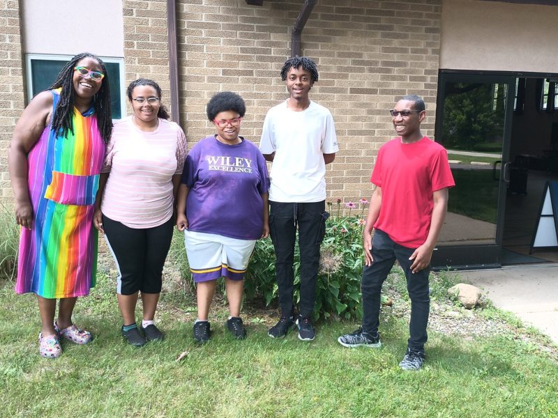 Ypsilanti Youth Choir founder Crystal Harding with several choir members outside Ypsilanti Free Methodist Church, where the choir rehearses.