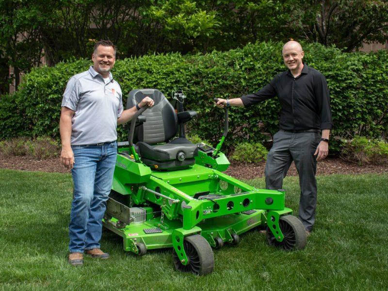 Tim Austin, president of A&H Lawn Services, and Mike Van Patten, director of commercial property management at Oxford Companies.