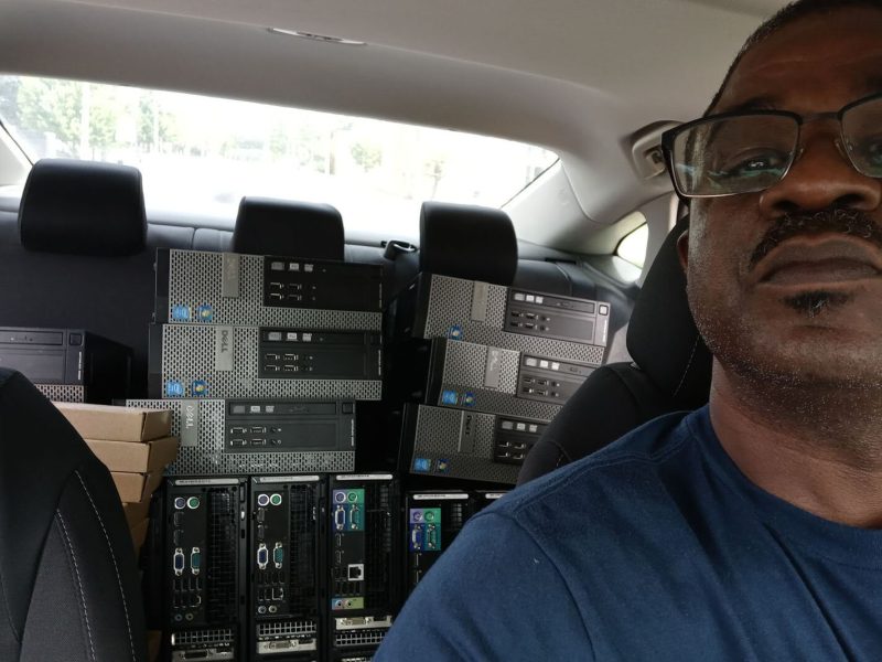 Tyrone Bridges with a car load of refurbished computers to be given away.