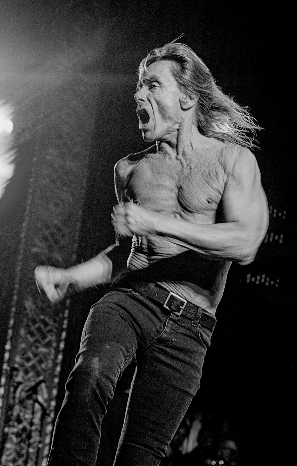 Iggy Pop performs at Iggy and the Stooges' tribute to late guitarist/bassist Ron Asheton at the Michigan Theater, photographed by Doug Coombe.