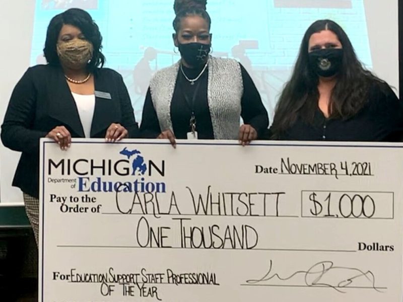 Better Me Youth founder Carla Whitsett accepts the state of Michigan's Support Staff Professional of the Year award.