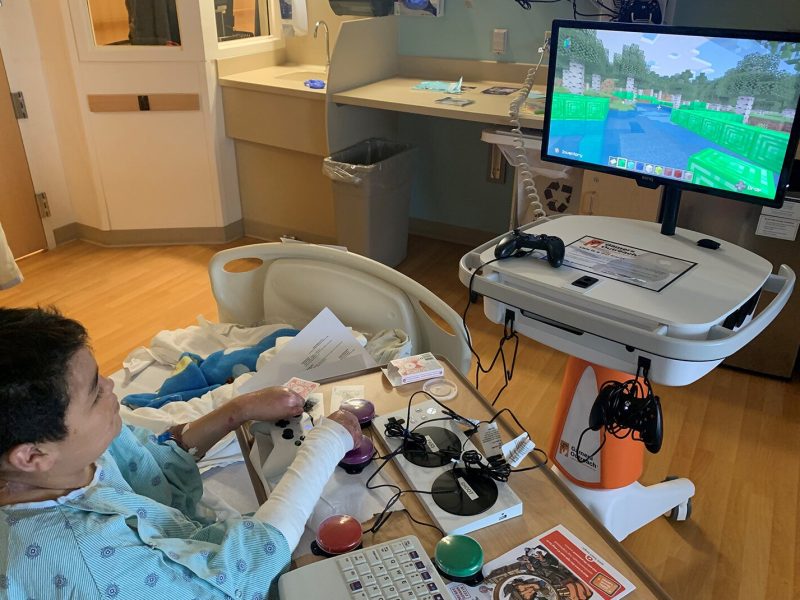 A Mott Children's Hospital patient plays a video game.