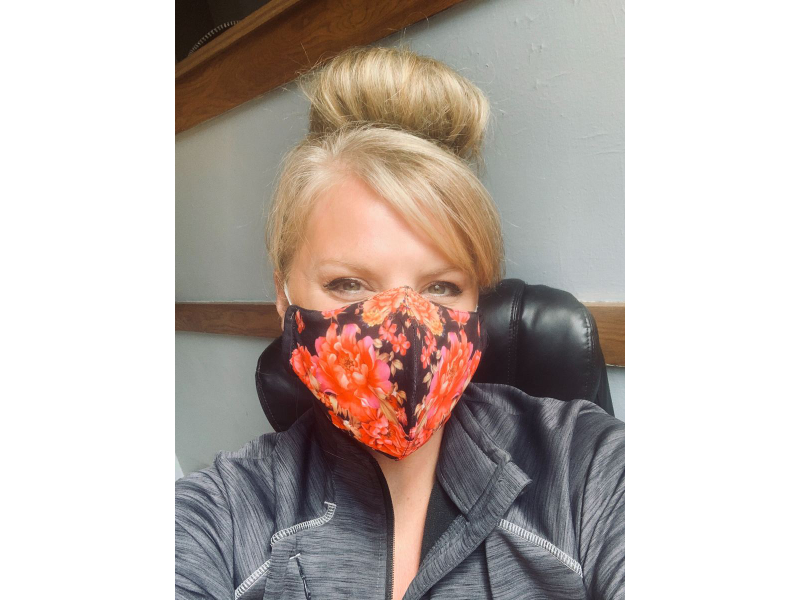 Mi Padrino founder and CEO Kim Gamez wears one of the masks she and her team created for DoYouMask.com.