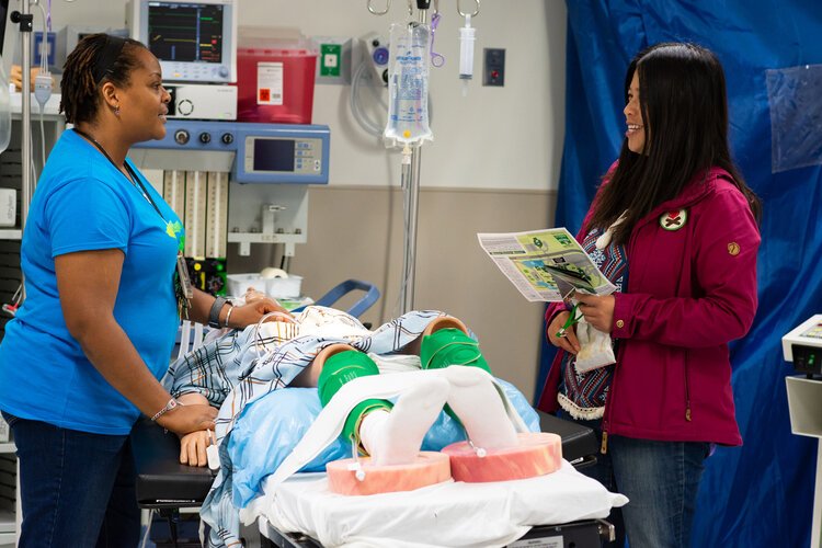 A Free College Day attendee talks with WCC Surgical Technology program director Elizabeth Connors at the fall 2018 event.