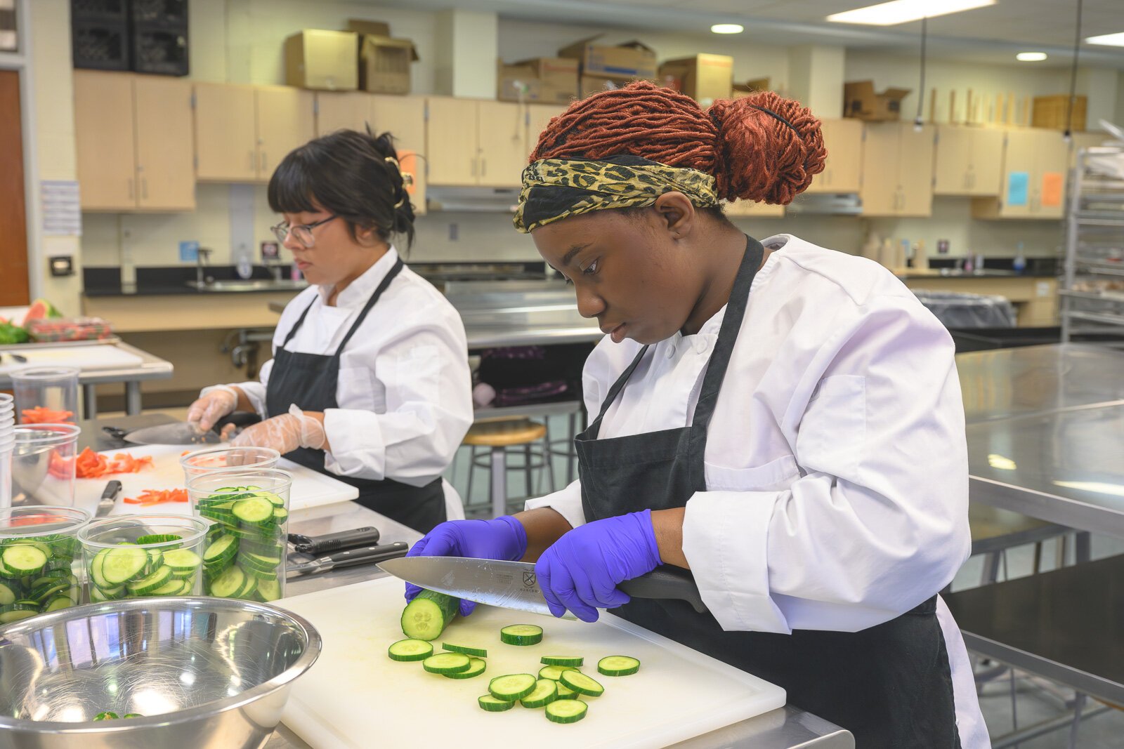 Students prepare food in Huron High School's Culinary and Hospitality class.