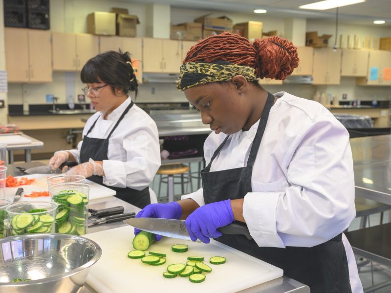Students prepare food in Huron High School's Culinary and Hospitality class.