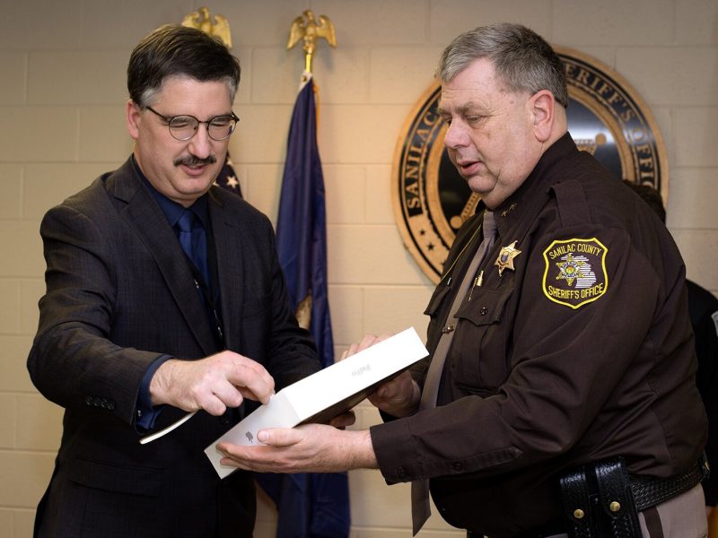 Sanilac County CMH CEO Wilbert Morris presents iPad to Sanilac County Sheriff Paul Rich