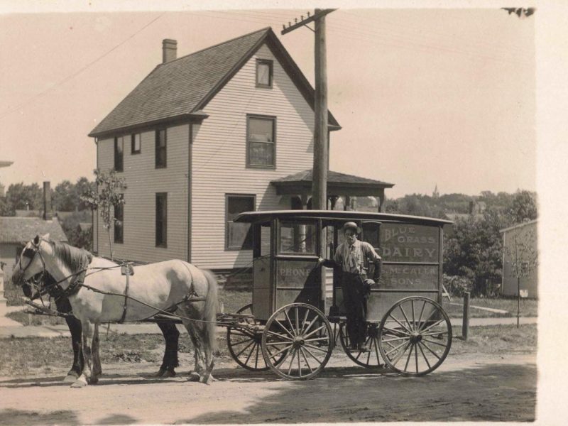 A postcard from the early 1900s depicting a dairy wagon owned by the Ann Arbor- and Pittsfield Township-based McCalla family. It is one of thousands of postcards to be digitized in a new database.