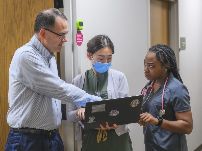 Dr. Ray Rion, executive director of Packard Health, with Packard Health staff.