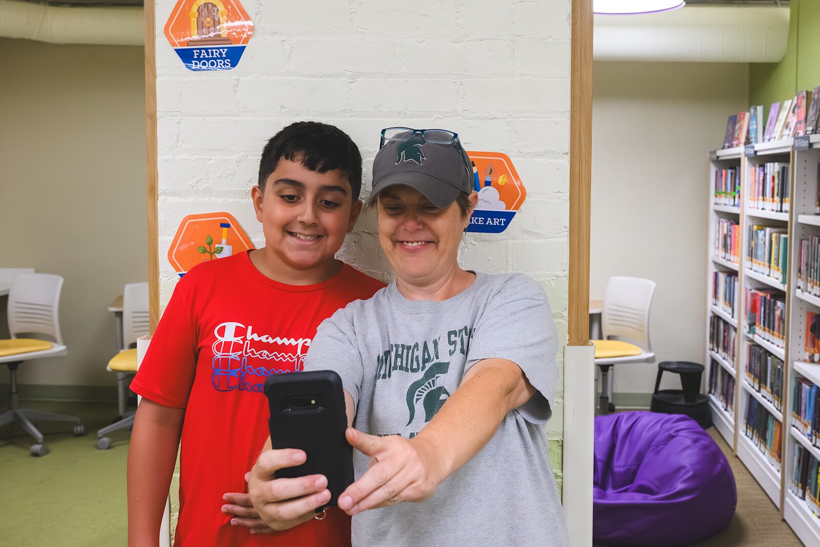 Mohammed Shawls and Dawn Kotcher participating in the Summer Challenge at YDL's Michigan Avenue branch.