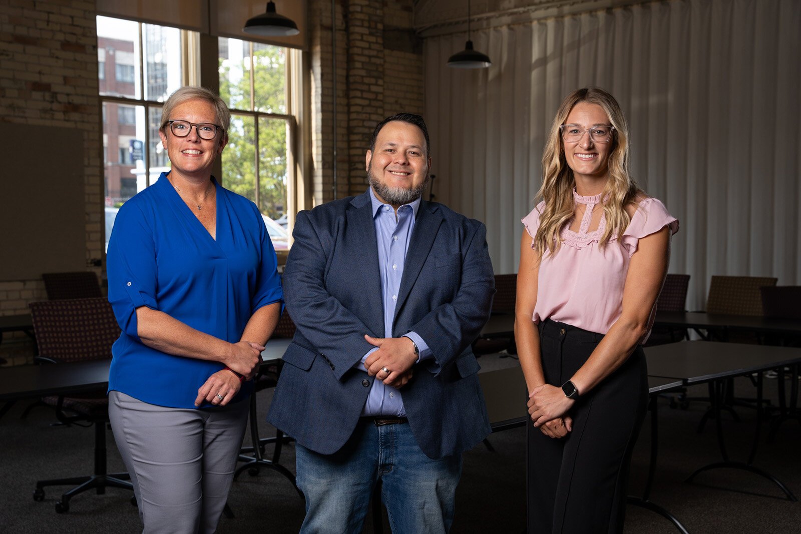 Heart of West Michigan United Way Chief Administrative Officer Becki Postma, Kent County Community Action Director Gustavo Perez, and Heart of West Michigan United Way Eviction Prevention Program Manager Alyssa Bryan.