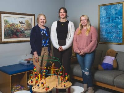 Karen Parish-Foster, clinical educator and co-coordinator of EMU's Speech and Hearing Clinic, with graduate students Mollie Spencer and Jaidyn Hinkley.