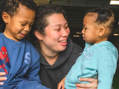 Ypsilanti resident Vahna Paige (center) with her children Ocean Blue (left) and Reign Blue (right). Paige, who is currently pregnant with her third child, is one of Ypsi's first participants in the RxKids cash assistance program for new moms and babies.